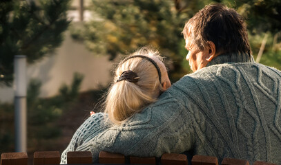 An elderly couple spending time together outdoors.