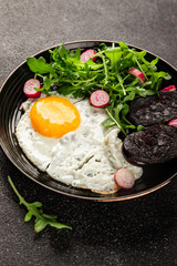 Eggs breakfast black pudding, egg, vegetables, arugula portion size natural product tasty snack fresh delicious gourmet food background on the table rustic top view copy space