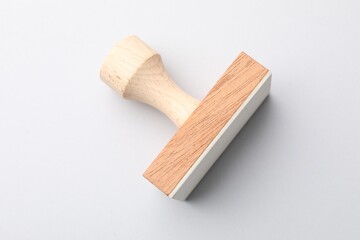 One wooden stamp on white background, top view