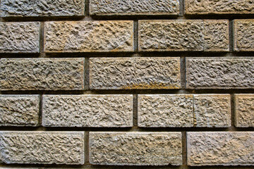 Textured stone wall showcasing natural patterns and earthy tones in a close-up view