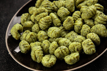 Gnocchi spinach potato dough second course portion size natural product tasty snack fresh delicious gourmet food background on the table rustic top view copy space