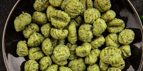 Gnocchi spinach potato dough second course portion size natural product tasty snack fresh delicious gourmet food background on the table rustic top view copy space
