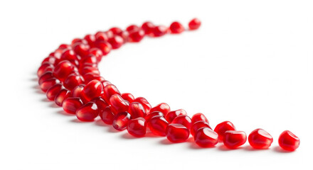 Vibrant Pomegranate Seeds Arranged in a Dynamic Curve on White
A clean, high-key studio shot featuring a collection of vibrant, jewel-toned red pomegranate seeds (arils) neatly arranged in a smooth