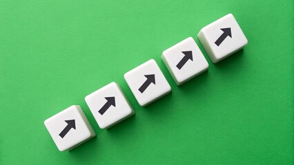 Obraz premium Upward Path – Front View Conceptual Symbolism, Diagonal Tiles with Black Arrows on Green Background, Progress and Growth Metaphor