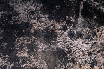 Extreme close-up of Old Weathered Concrete Wall with black mildew stains background grunge texture