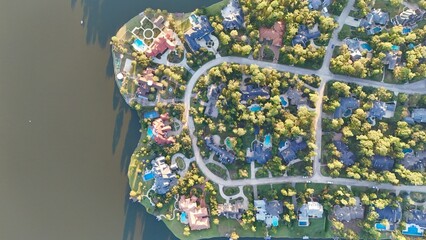 Aerial view of luxurious houses with swimming pool by Woodlands  lake, Houston,Texas