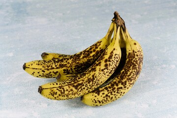 Photo of five browning fairtrade bananas.