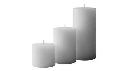 Three white pillar candles of varying sizes isolated on transparent background