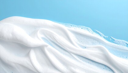 White Foam Waves Against a Soft Blue Background