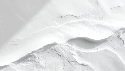 Obraz premium Abstract macro texture of white sand dunes with dramatic shadows and highlights under bright sunlight creating a minimalist landscape pattern