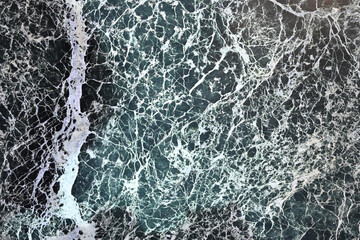 Verdant Veins: Intricate Close-Up of Polished Marble Featuring Striking Green and Black Abstract Veining