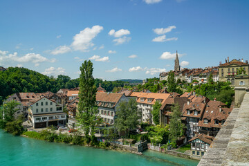 Obraz premium View of the city of Bern in Switzerland Part of the Aare River and the bridge are visible The weather is sunny and clear, the sky is blue with a few clouds