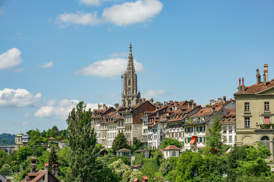 A city Bern in Switzerland with a tall building in the middle and a lot of houses surrounding it