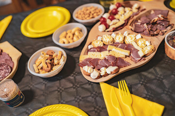 Party celebrating with charcuterie board food and snacks
