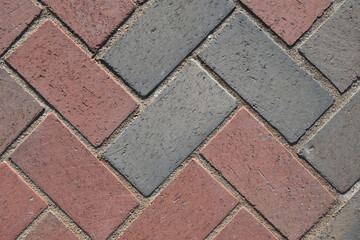Close-Up View of Paver Bricks Laid in a Detailed Herringbone Pattern on a Walkway