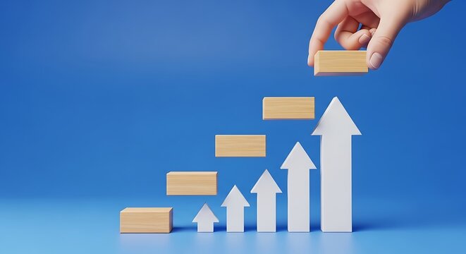 Hand placing wooden block on stairstep chart with upward arrows symbolizing growth and progress