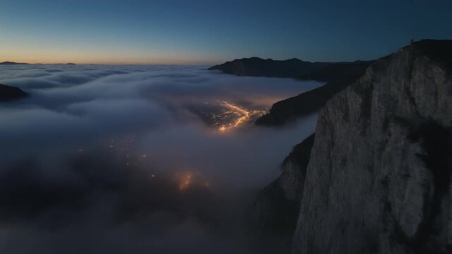 faintly visible under a blanket of clouds, creating a beautiful contrast between nature and civilization. This video is suitable for projects that require a sense of tranquility, natural beauty, or as