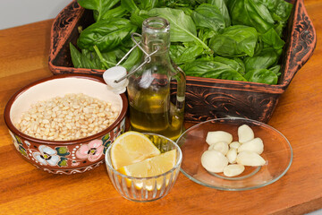 Ingredients for preparation of the sauce basil pesto on table