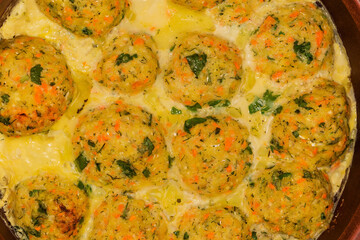 Baked and stewed salmon patties, top view close-up