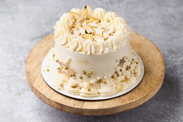 Delicious cake with Christmas decor on grey table, closeup