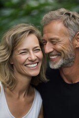 Obraz premium Smiling caucasian mature couple in outdoor setting