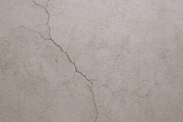 Fototapeta premium Cracked Concrete Wall Close-Up: Architectural Damage and Structural Defect Showing Aging and Deterioration