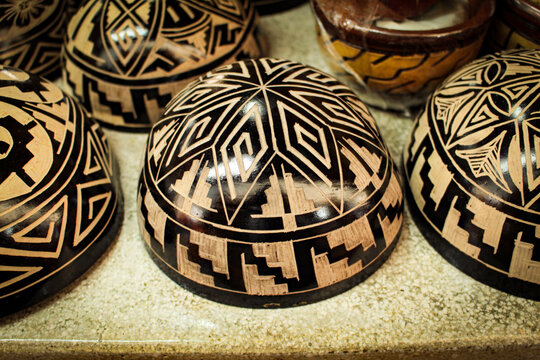 Indigenous bowls, handicrafts from the Brazilian Amazon, made from the fruit of the Cujite Crescentia, decorated with geoglyphs, for sale as souvenirs to tourists in the city of Bel&eacute;m, Par&aacute;, Brazil