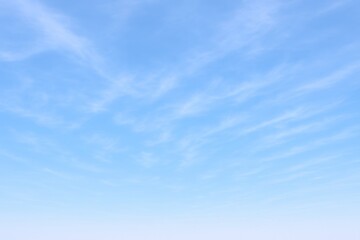 Fototapeta premium Serene Blue Sky with Cirrus Clouds Background - Peaceful, Calm, and Ideal for Design Overlays