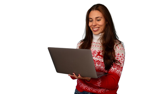 Woman in christmas sweater making video call on laptop, celebrating online during holiday season - Powered by Adobe