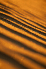 Beautiful sand patterns at the beach of Baltic Sea. Sunny summer evening in Latva.