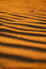 Beautiful sand patterns at the beach of Baltic Sea. Sunny summer evening in Latva.