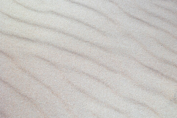 Beautiful sand patterns at the beach of Baltic Sea. Sunny summer evening in Latva.