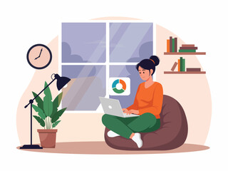 Woman working on laptop while sitting on beanbag chair