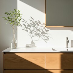 Sunlit modern bathroom interior with wooden vanity and plant casting shadows on the wall.