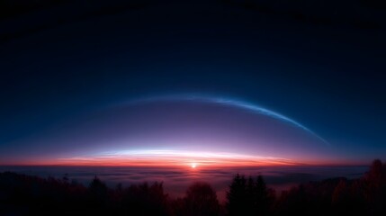 Naklejka premium Panoramic view of a majestic dawn sky featuring vibrant colorful atmospheric bands and a glowing horizon above a misty silhouetted forest