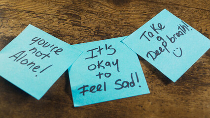 Sticky notes displaying mental health support messages