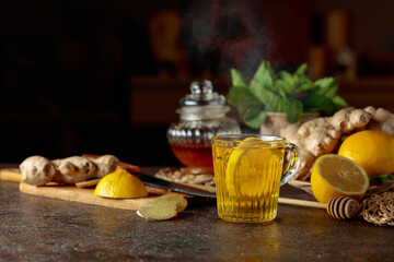 Ginger tea with lemon, honey, mint, and ginger root.