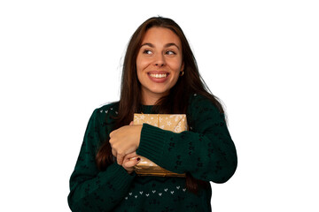 Fototapeta premium Happy young woman receiving christmas present, smiling holding gift box wearing festive green sweater