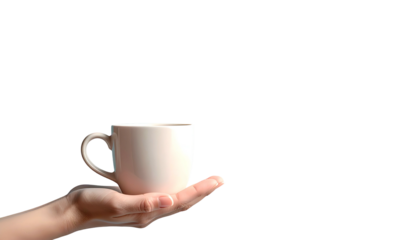 A hand, palm up, delicately holds a ceramic mug against a stark black backdrop