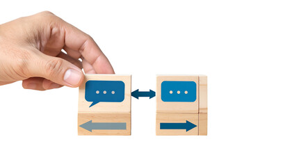 Hand connecting wooden blocks with speech bubble, arrows, conveying communication