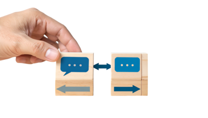 Hand connecting wooden blocks with speech bubble, arrows, conveying communication