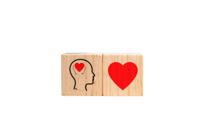 Two wooden cubes side by side; one features a brain-heart, the other a heart