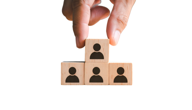Hand arranging wooden blocks with person icons, symbolizing hierarchy & team