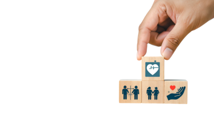 A hand places a health icon block on a stack of health related icons