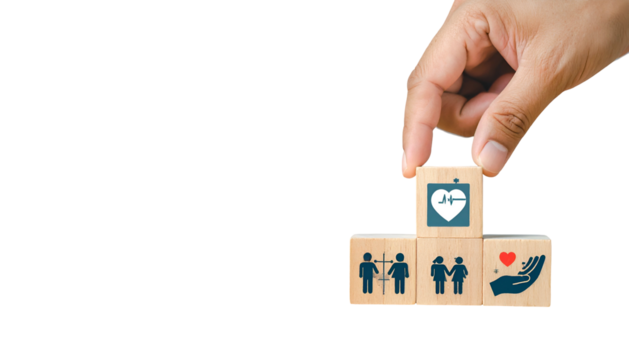 A hand places a health icon block on a stack of health related icons