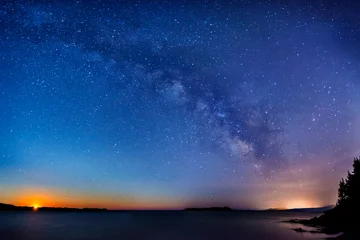 Selbstklebende Fototapeten Sonnenuntergang Meer Milky way sunset over the sea  © Luca