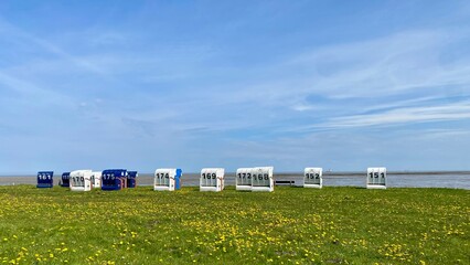 beautiful view of the horumersiel at the north sea with beach chairs