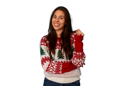 Young woman smiling, wearing festive christmas sweater with tree and snowflake patterns, posing for holiday season