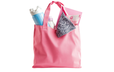 Breast cancer awareness tote bag containing informational items promoting compassion wellness and prevention isolated on white background PNG