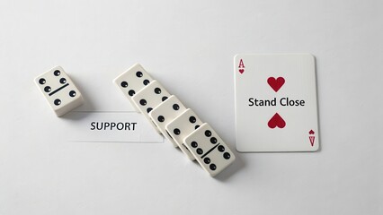 Fototapeta na wymiar Support and Strategy in Gaming with Dominoes and Playing Cards